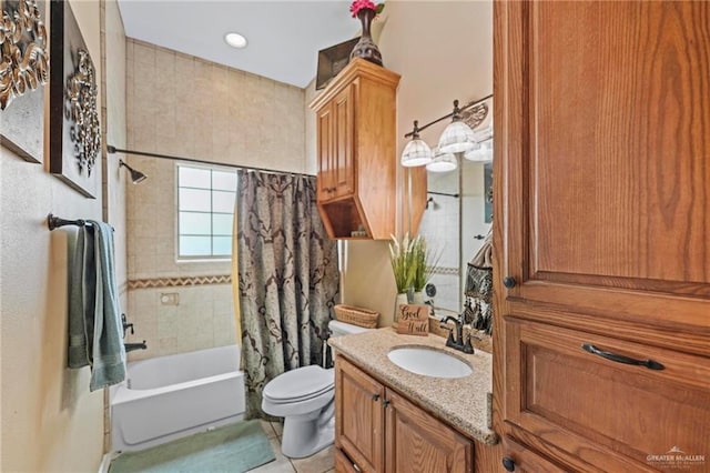 full bathroom with tile patterned flooring, vanity, toilet, and shower / tub combo