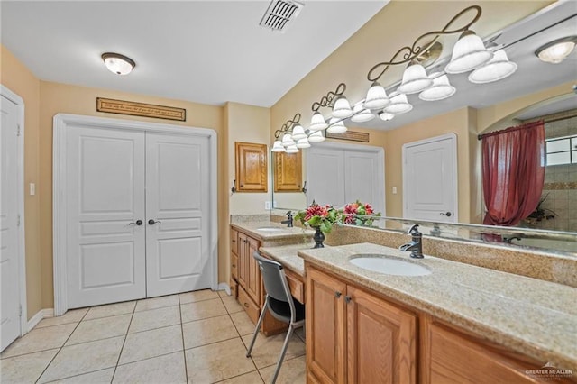 bathroom with vanity and tile patterned floors