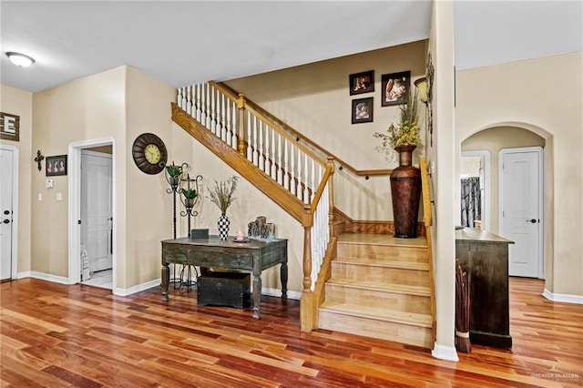 stairs featuring hardwood / wood-style flooring