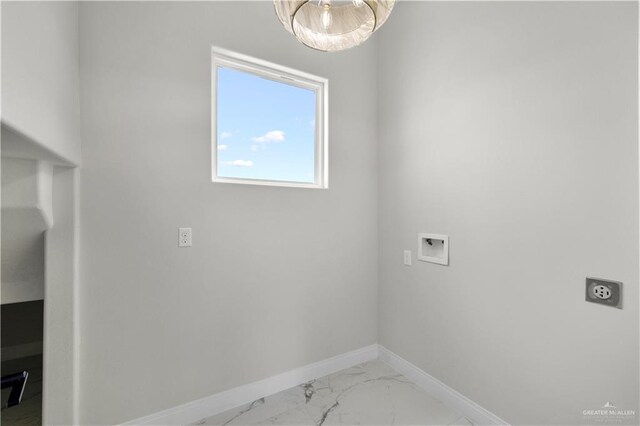 1013 N Buxton Ave, Edinburg, TX 78541 - washroom featuring electric dryer hookup, baseboards, washer hookup, light marble finish floors, and a chandelier