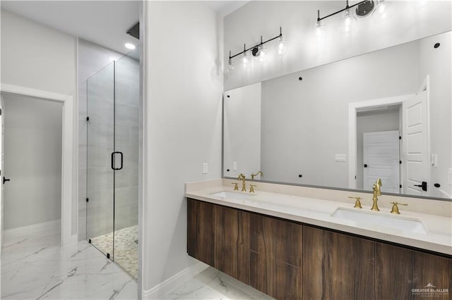 bathroom with marble finish floors, a shower stall, baseboards, and double vanity