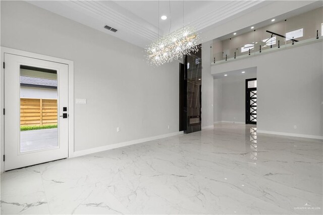 1013 N Buxton Ave, Edinburg, TX 78541 - empty room with marble tiled flooring, a chandelier, baseboards, recessed lighting, and a high ceiling