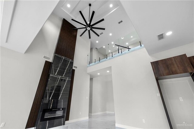 1013 N Buxton Ave, Edinburg, TX 78541 - unfurnished living room with a ceiling fan, a towering ceiling, and recessed lighting