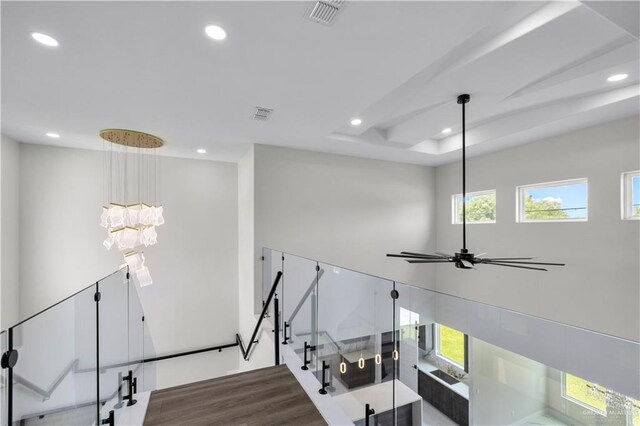 1013 N Buxton Ave, Edinburg, TX 78541 - stairway featuring recessed lighting, healthy amount of natural light, wood finished floors, and a chandelier