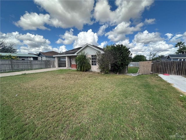 view of yard with a garage