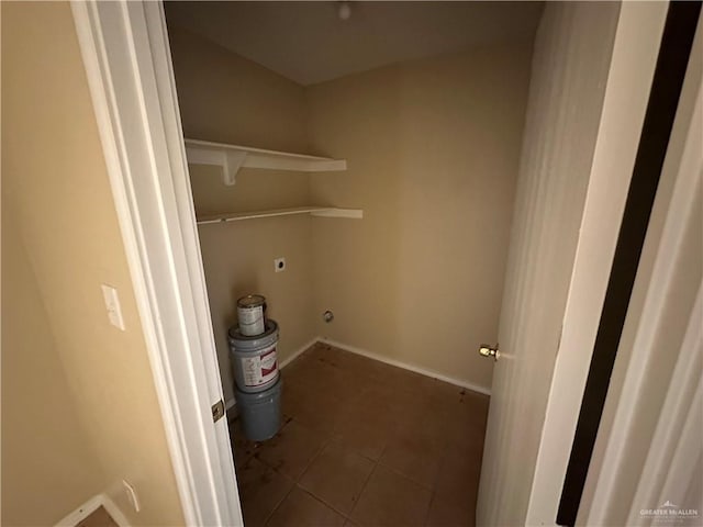 clothes washing area featuring tile patterned floors and electric dryer hookup