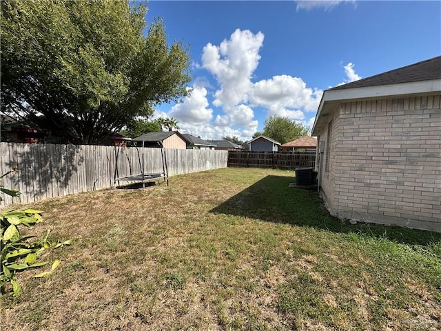 view of yard featuring central AC unit