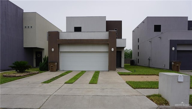 contemporary house featuring a front lawn and central air condition unit