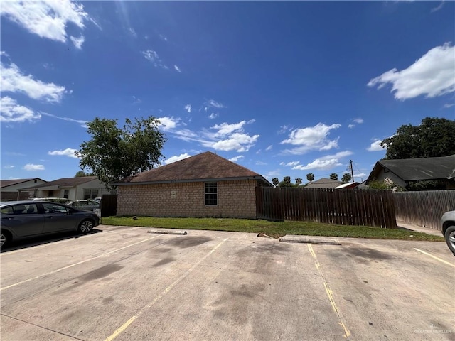 view of side of home featuring a yard