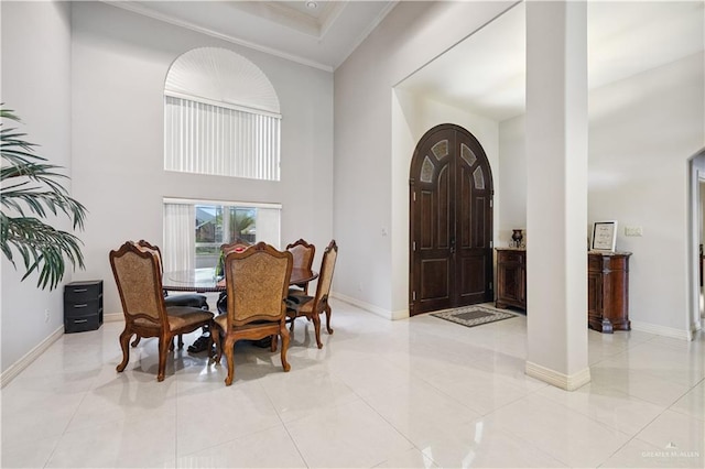 2005 E 28th St, Mission, TX 78574 - entryway with ornamental molding, a high ceiling, light tile patterned floors, and ornate columns