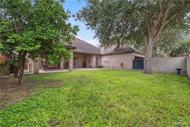 2005 E 28th St, Mission, TX 78574 - rear view of house featuring a patio