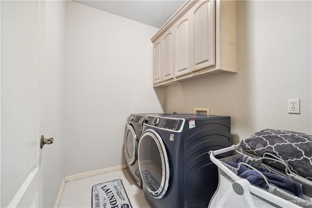 2005 E 28th St, Mission, TX 78574 - washroom with washing machine and dryer and cabinet space
