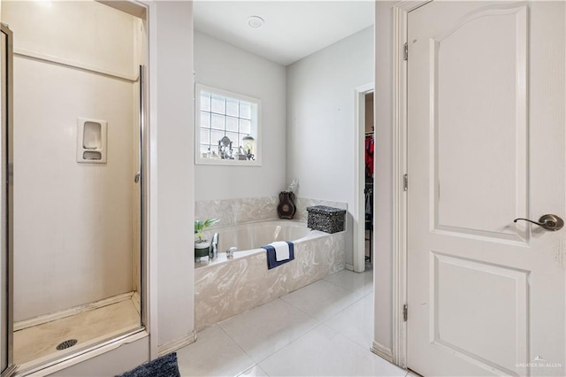 2005 E 28th St, Mission, TX 78574 - bathroom featuring tile patterned floors, a shower stall, and a bath