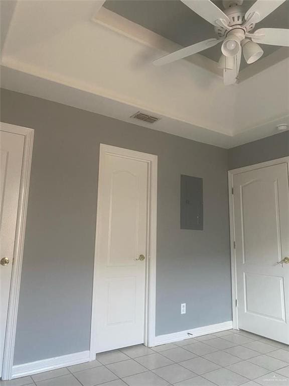 1706 Phoenix St, Edinburg, TX 78541 - unfurnished bedroom featuring baseboards, electric panel, visible vents, and light tile patterned floors