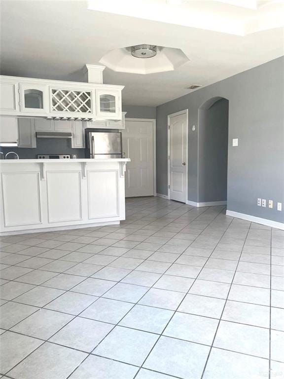 1706 Phoenix St, Edinburg, TX 78541 - interior space featuring arched walkways, baseboards, and light tile patterned floors