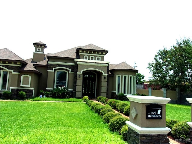 view of front of home with a front lawn