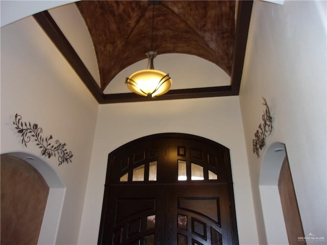 foyer featuring high vaulted ceiling