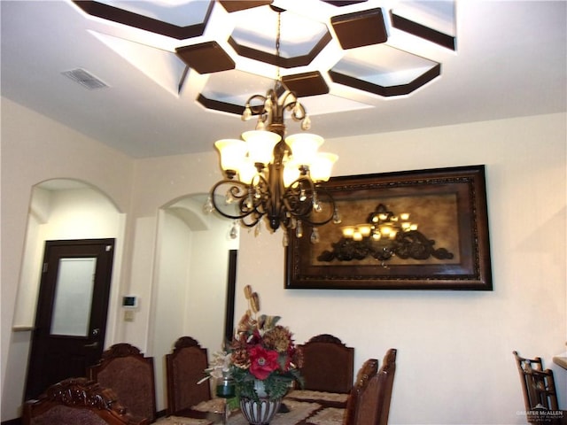 dining space featuring a chandelier