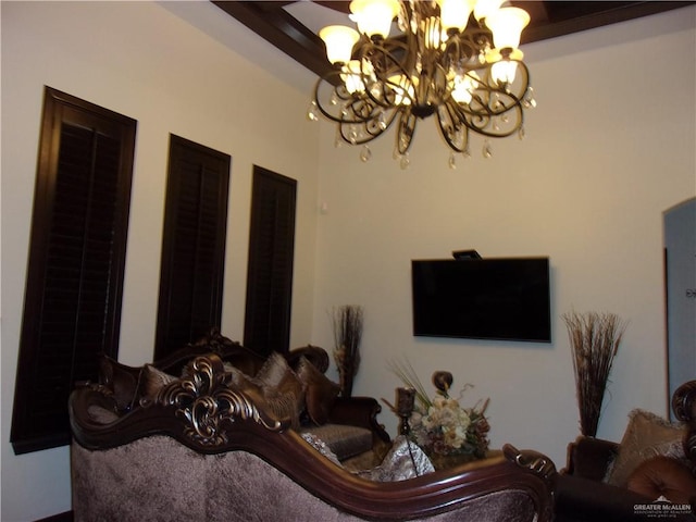 living room with an inviting chandelier