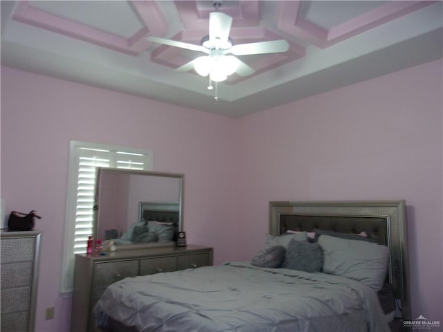 bedroom featuring ceiling fan and coffered ceiling