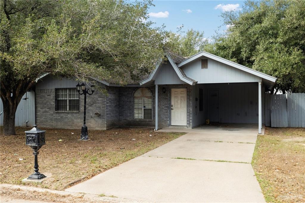 view of front of home featuring a carport