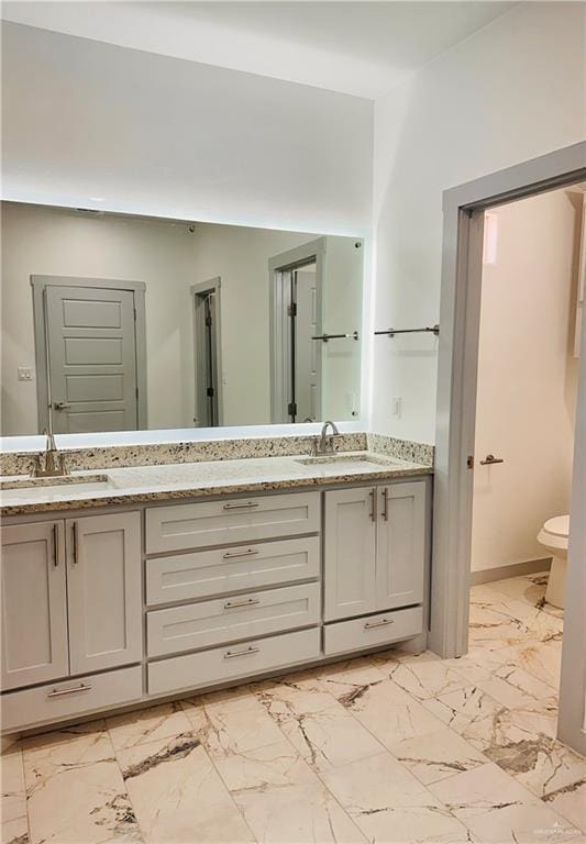 bathroom with vanity and toilet