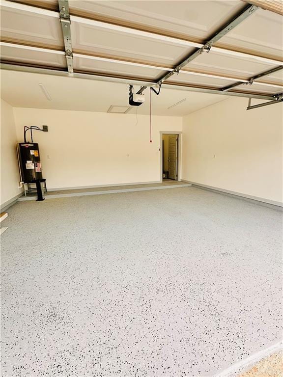 garage featuring electric water heater and a garage door opener