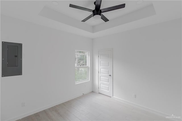 2005 Hacienda Cir, Harlingen, TX 78552 - empty room featuring electric panel, baseboards, and a tray ceiling
