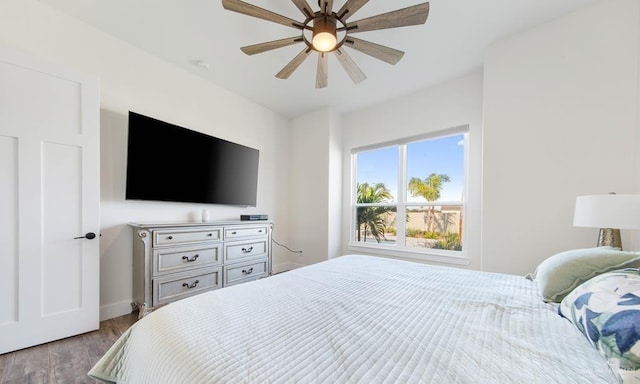 bedroom with light wood-type flooring and ceiling fan