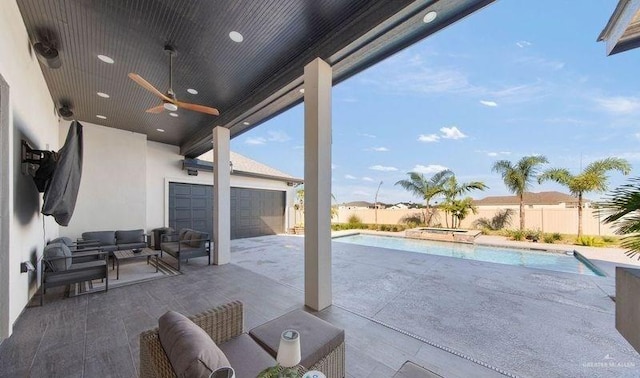 view of patio / terrace featuring an outdoor living space, a fenced in pool, and ceiling fan