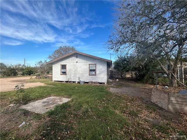 view of home's exterior with a lawn