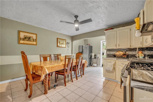 2865 E Mile 9 1/2 N, Donna, TX 78537 - dining area with light tile patterned flooring, a ceiling fan, and a textured ceiling