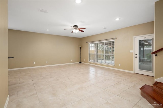 unfurnished room featuring ceiling fan and light tile patterned floors