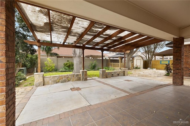 view of patio featuring a storage shed