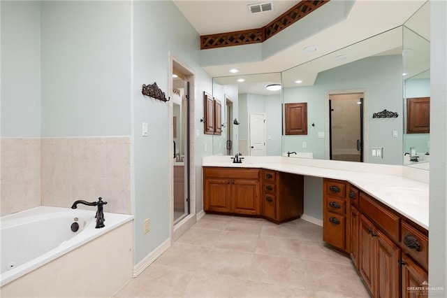 bathroom featuring tile patterned floors, vanity, and plus walk in shower