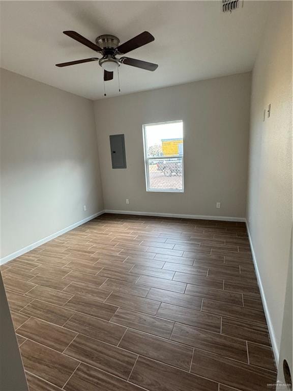 unfurnished room featuring ceiling fan and electric panel