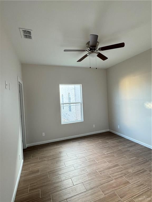 spare room featuring ceiling fan