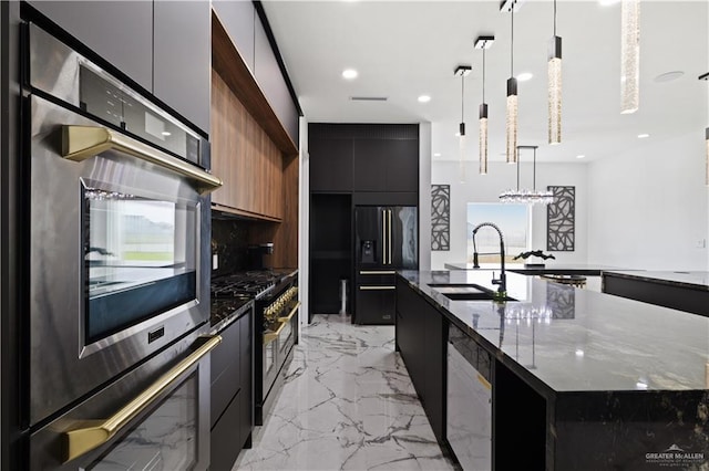 4648 Estancia Pkwy, Mcallen, TX 78504 - kitchen featuring modern cabinets, appliances with stainless steel finishes, dark cabinets, a spacious island, and recessed lighting