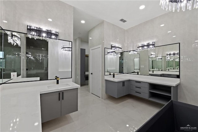 4648 Estancia Pkwy, Mcallen, TX 78504 - bathroom with two vanities, a chandelier, marble finish flooring, and an enclosed shower
