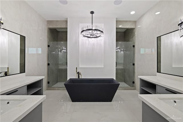 4648 Estancia Pkwy, Mcallen, TX 78504 - full bathroom with a stall shower, a soaking tub, two vanities, and a chandelier
