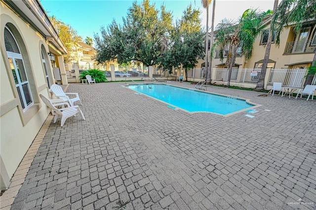 view of swimming pool featuring a patio