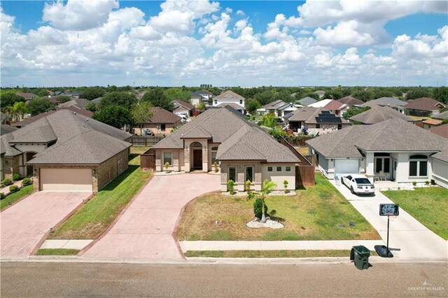 view of front of house featuring a front lawn and a garage