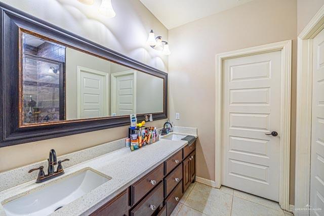 bathroom with vanity and tile patterned floors