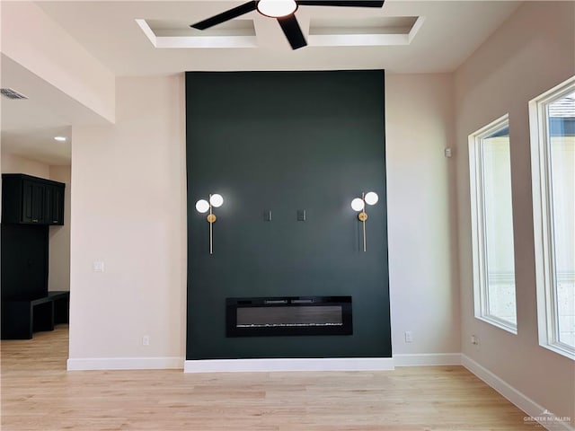 interior space with light wood-style flooring, visible vents, and baseboards