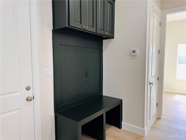 mudroom with light wood-type flooring and baseboards