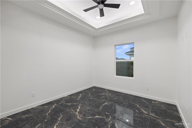 3009 E Bella Vista Ave, Alton, TX 78573 - empty room featuring a tray ceiling, marble finish floor, baseboards, ceiling fan, and ornamental molding