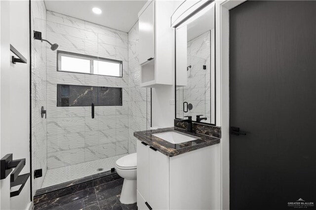 3009 E Bella Vista Ave, Alton, TX 78573 - bathroom with toilet, a stall shower, and vanity