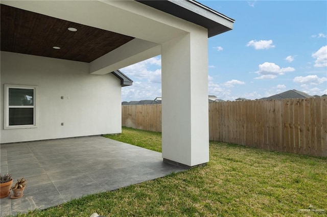 view of yard featuring a fenced backyard and a patio area