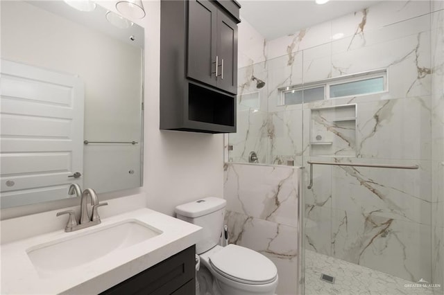 full bathroom featuring toilet, a marble finish shower, and vanity