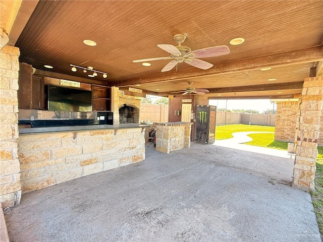 1813 Harvard Ave, Mcallen, TX 78504 - view of patio with fence, ceiling fan, and a bar